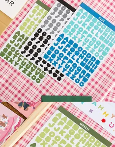 Multiple sheets of colorful alphabet and number stickers for scrapbooking and DIY crafts.