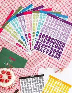 Vibrant collection of bubble font alphabet and number sticker sheets for DIY craft and journal.