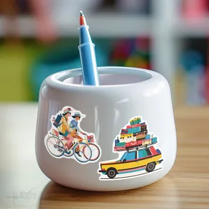 Close-up of travel themed waterproof stickers applied on a white ceramic pen holder