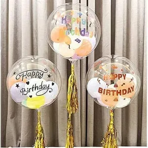 Detailed view of Happy Birthday stickers applied on transparent balloons with gold tassels.