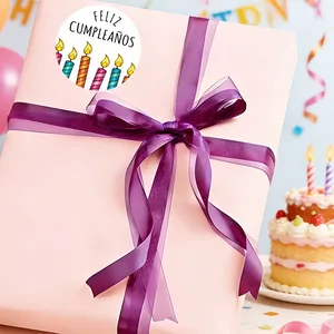 Feliz Cumpleaños sticker label on a pink gift box for birthday decoration