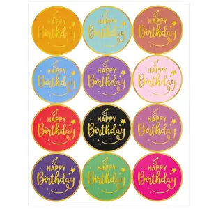 Twelve colorful round Happy Birthday stickers with gold foil lettering for gift sealing