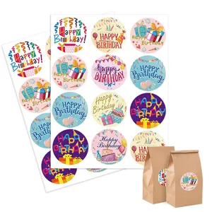 Detail view of Happy Birthday stickers applied on brown paper gift bags