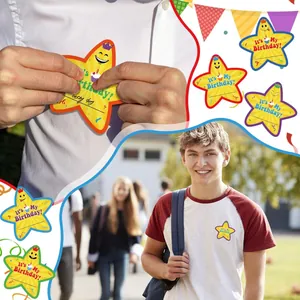 Detail view of colorful star-shaped 'It's My Birthday!' stickers for party favors