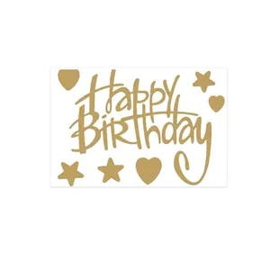 Detailed macro view of gold foil Happy Birthday sticker set featuring heart and star patterns
