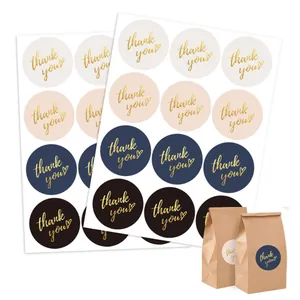 Detailed view of 5cm gold foil Thank You stickers for gift bags and wedding favors.