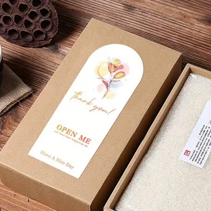 Close-up detail of a floral print self-adhesive seal sticker on a brown paper gift box
