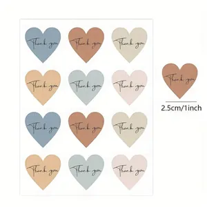 Macro view of 12 colorful heart-shaped thank you stickers sheet with 1 inch size detail