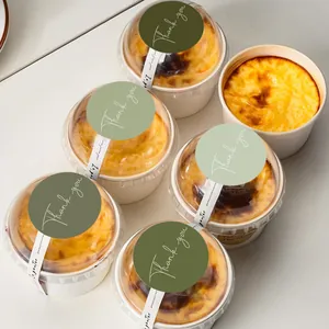 Set of five 5cm round green thank you stickers used for sealing dessert packaging boxes