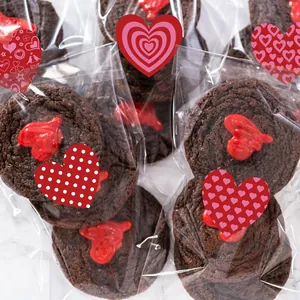 Close-up of assorted heart stickers used as sealing labels on clear gift bags