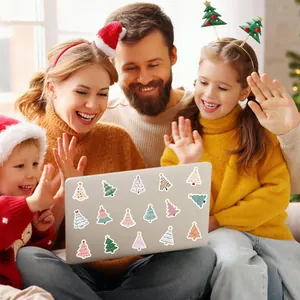 Detailed view of cute Christmas tree stickers applied on a laptop back for decoration