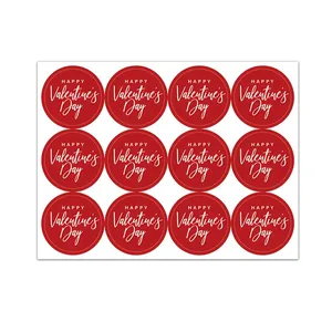 A sheet of 12 red circular stickers featuring white cursive Happy Valentine's Day text.