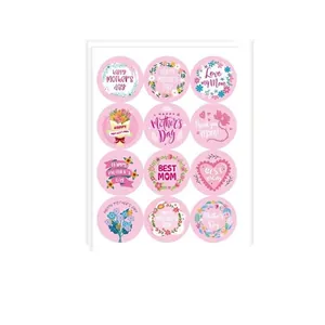 Close-up of pink Mother's Day sealing stickers with floral and heart designs
