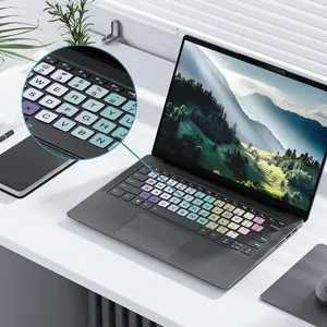 Detailed view of colorful English alphabet keyboard stickers on a laptop device