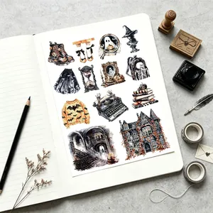 Watercolor Halloween stickers featuring spooky illustrations on a stationery notebook