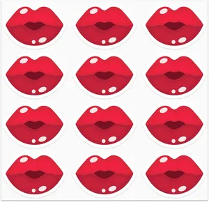 Detailed view of red glossy lip stickers for Valentine's Day scrapbooking