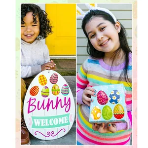 Happy children holding Easter themed egg signs and decorative gift boxes with stickers