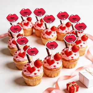 Detail of 12 red lip cake toppers on frosted cupcakes arranged in a heart shape
