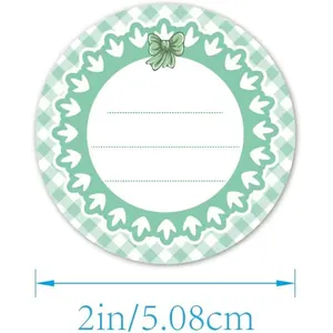 Detailed close-up of a 2-inch round green gingham canning label with writing lines