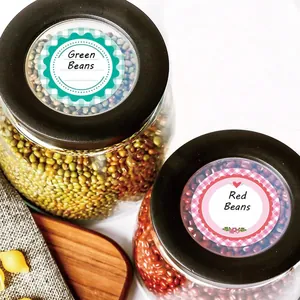Detailed view of 2-inch round gingham canning labels applied on glass jar lids