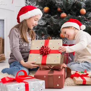 Decorative mini laser Christmas ball stickers on holiday gift boxes in a festive home setting