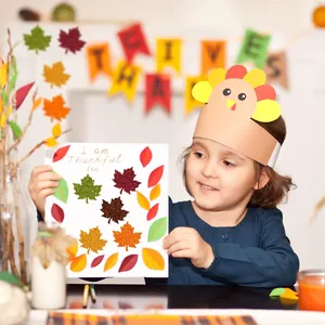 Detail shot of sparkling glitter maple leaf stickers on a handmade card for kids