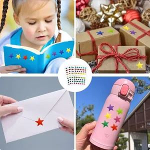 Colorful holographic star stickers applied on books, gift boxes, and a water bottle.