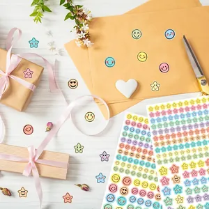 Close-up detail of macaron colored smiley face and star stickers for scrapbooking and gifts