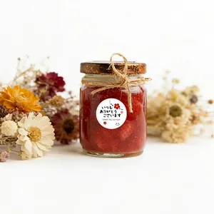 Vista detallada de pegatinas redondas 'Thank You' para envases de regalo creativos