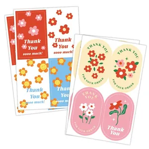 Vista detallada de varias pegatinas de Thank You con lindos diseños de flores y sonrisas