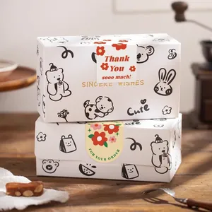 Primer plano de pegatinas creativas de Thank You en inglés para cajas de regalo blancas