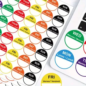 Close-up of colorful multilingual weekly planner stickers for organizing tasks