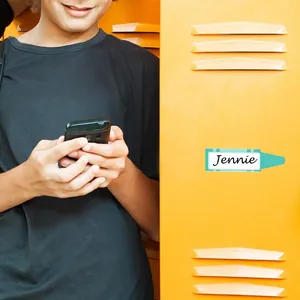 Cartoon pencil-shaped name tag sticker 'Jennie' displayed on a school locker.