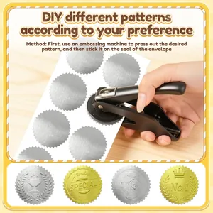 Using a manual embossing machine to create custom patterns on silver foil stickers