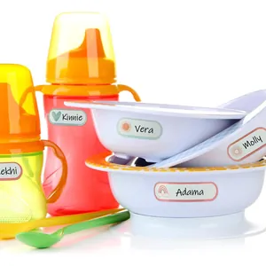 Detail view of cute personalized name labels applied to baby bowls and sippy cups