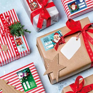 Festive Christmas To-From gift labels with Santa and snowman designs on wrapped boxes.