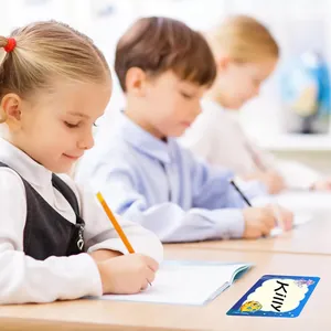 Writable ocean themed name label sticker with cartoon fish shown on a classroom desk