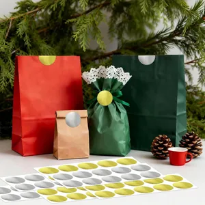 Large 50mm gold and silver serrated gear seal stickers applied on festive gift bags
