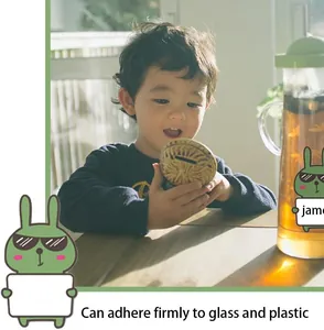 Self-adhesive writable cartoon animal name labels applied on a glass water pitcher