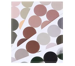 Close-up detail of self-adhesive multi-color circular dot stickers in elegant Morandi tones