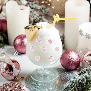 Close-up of pink swirl mini stickers used for decorating a festive cocktail glass