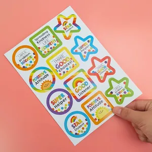 Close-up view of colorful cartoon reward stickers featuring positive English phrases
