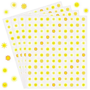 Detailed view of multiple sheets containing cute yellow sun smiley face stickers for kids