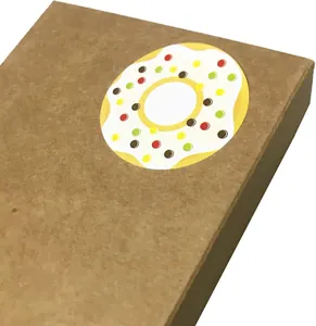 Close-up detail of a 3.8cm round donut sticker with white icing and colorful sprinkles