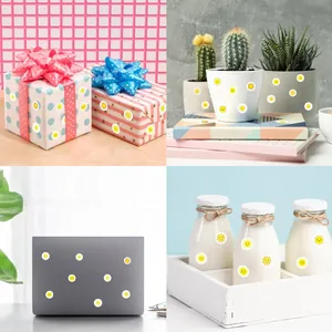 Yellow sun smiley stickers shown on gift boxes, plant pots, laptop and milk bottles