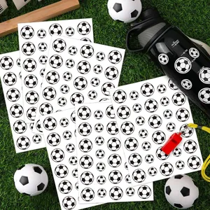 Detailed view of waterproof soccer ball stickers on green grass with sports props