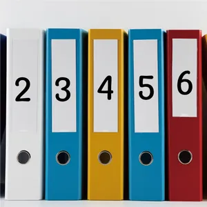 Detail of waterproof 1-inch number stickers applied to colorful office file binders