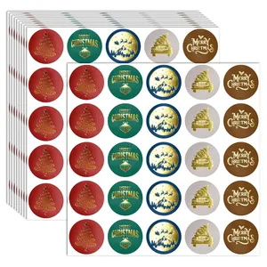 Detailed view of 5 assorted gold foil Merry Christmas sticker sheets for gifts