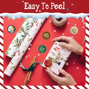 Detail view of festive Christmas gold foil stickers sealing a red holiday gift box