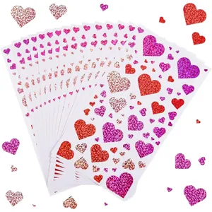 Vibrant laser glitter heart stickers in red pink and purple for craft decoration